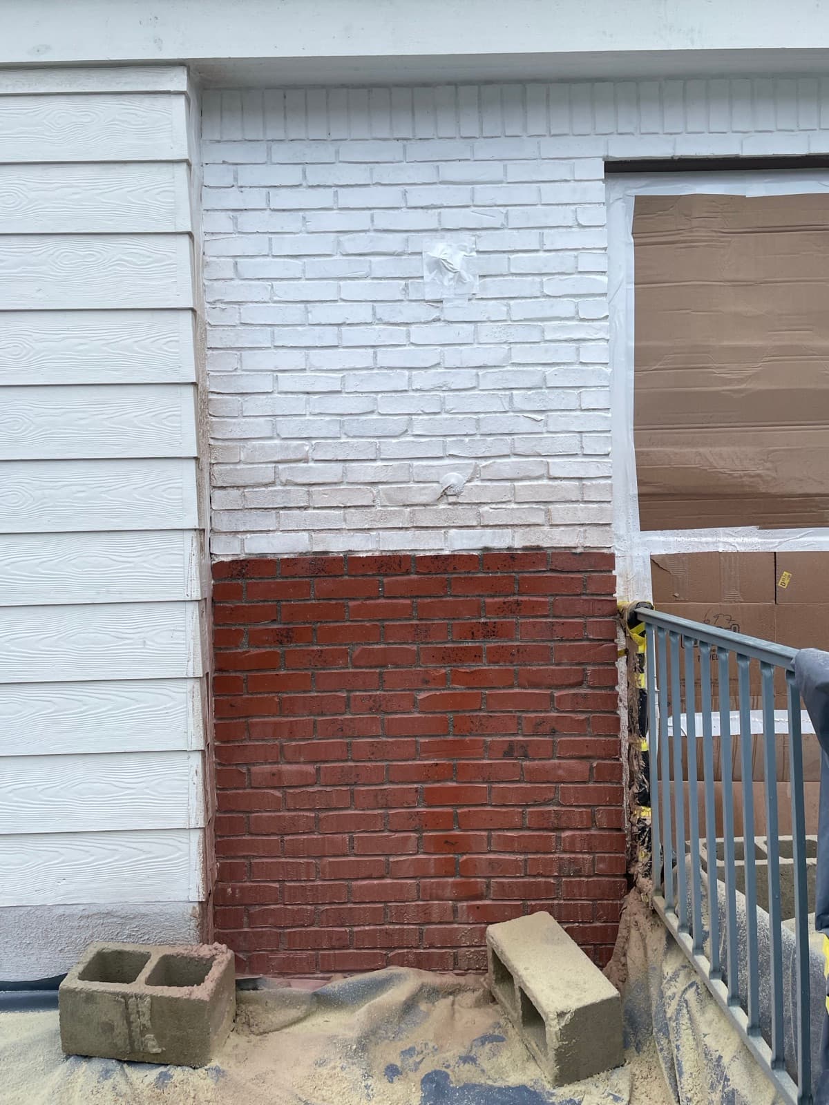 Brick wall paint removal showing substrate intact