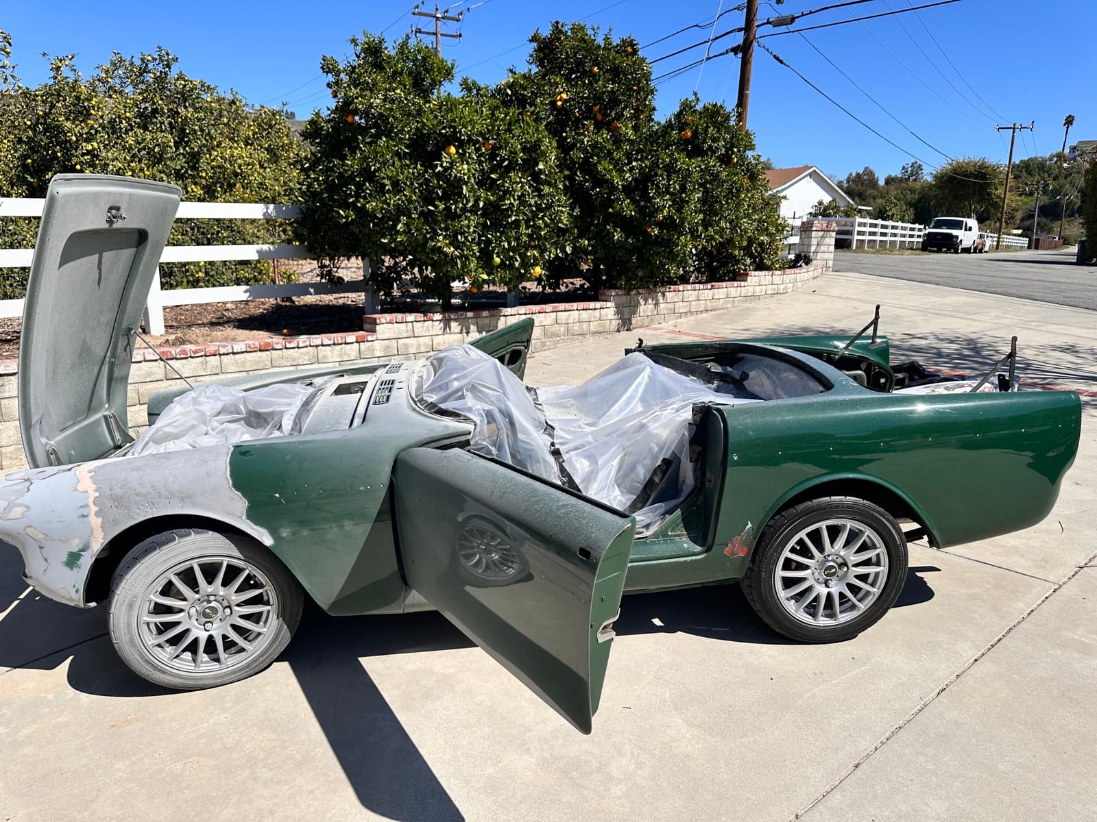 Classic green convertible before dustless blasting