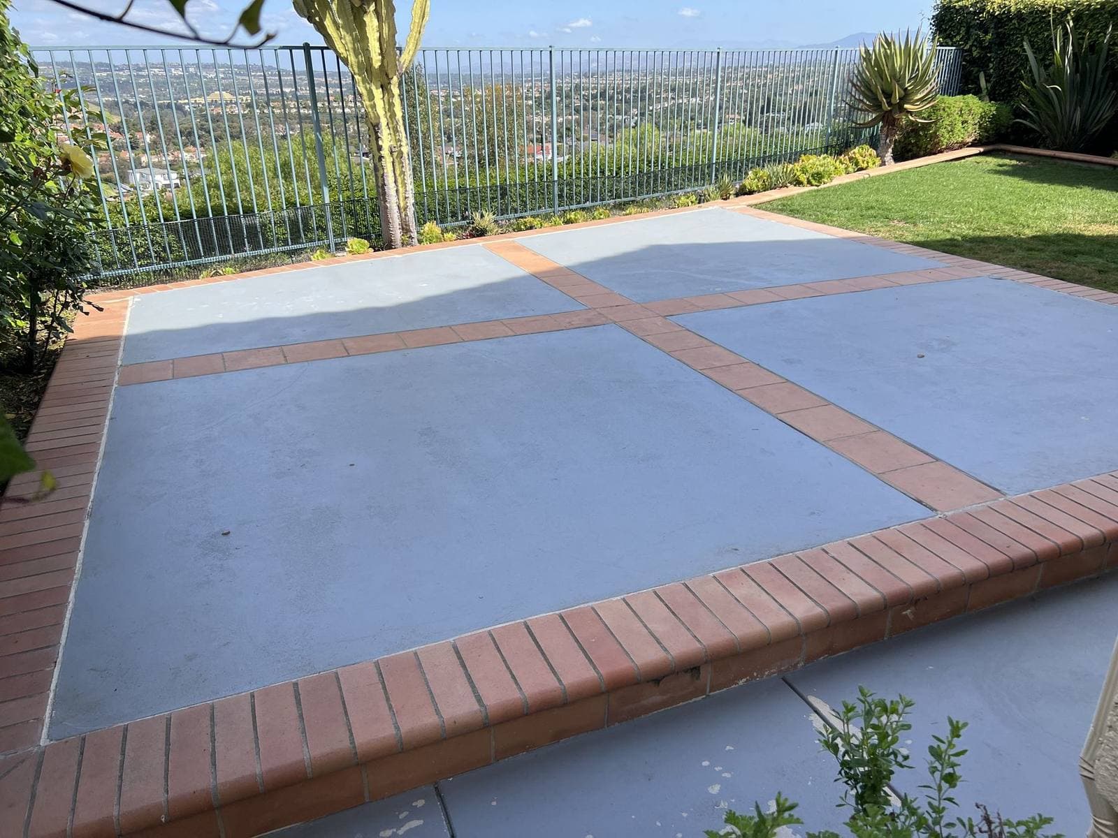 Painted patio surface before dustless blasting